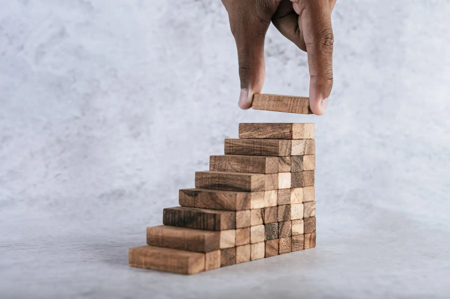 Stacking wooden blocks like stairs